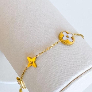 PULSEIRA TREVO BRANCO E DOURADO STEEL