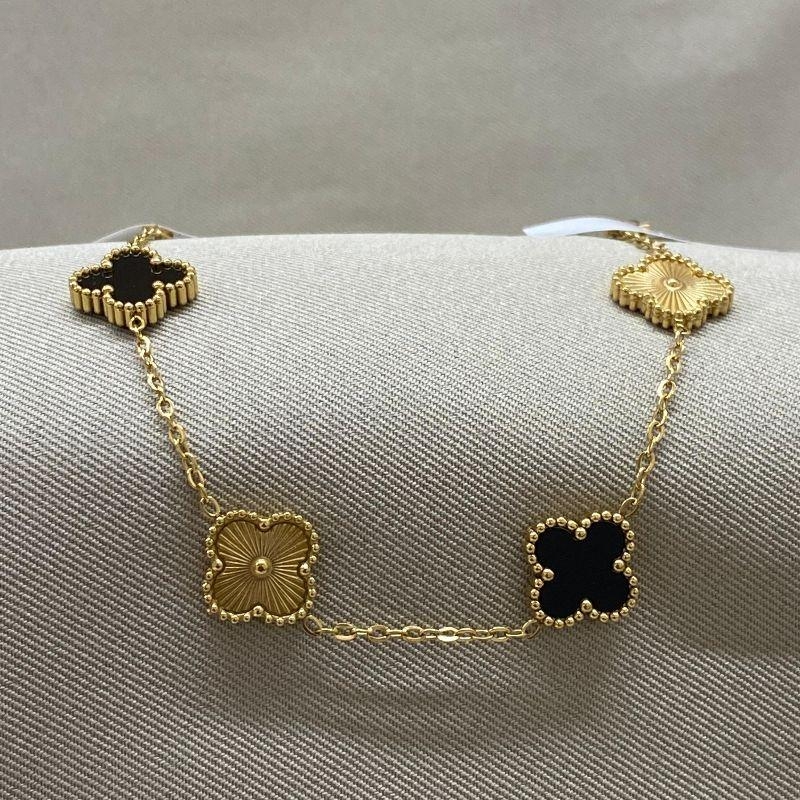 PULSEIRA 4 TREVOS PRETO E DOURADO STEEL