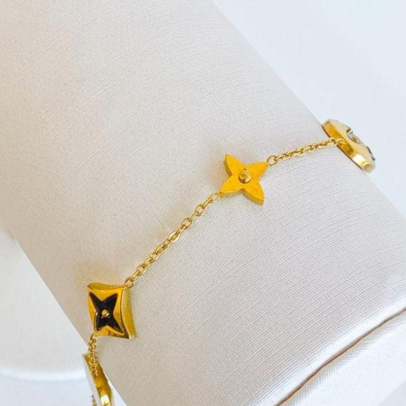 PULSEIRA TREVO PRETO E DOURADO STEEL