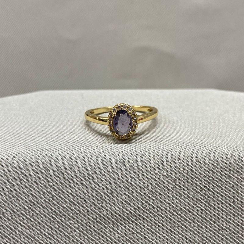 ANEL PEDRA OVAL LILAS CRAVEJADA EM VOLTA