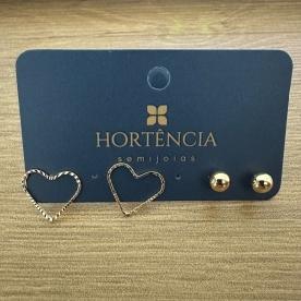 BRINCO DUPLA CORAÇÃO VAZADO/BOLA LISA