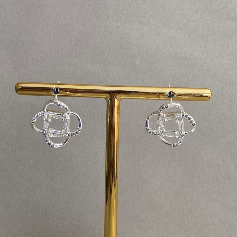 BRINCO FLOR VAZADA COM ZIRCONIA