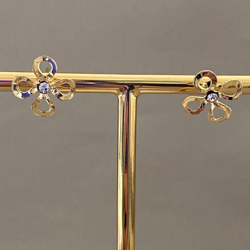 BRINCO FLOR VAZADA COM ZIRCONIA