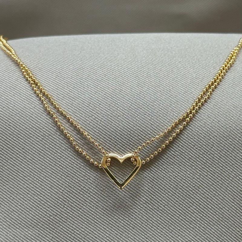 PULSEIRA BOLINHAS COM CORAÇÃO VAZADO