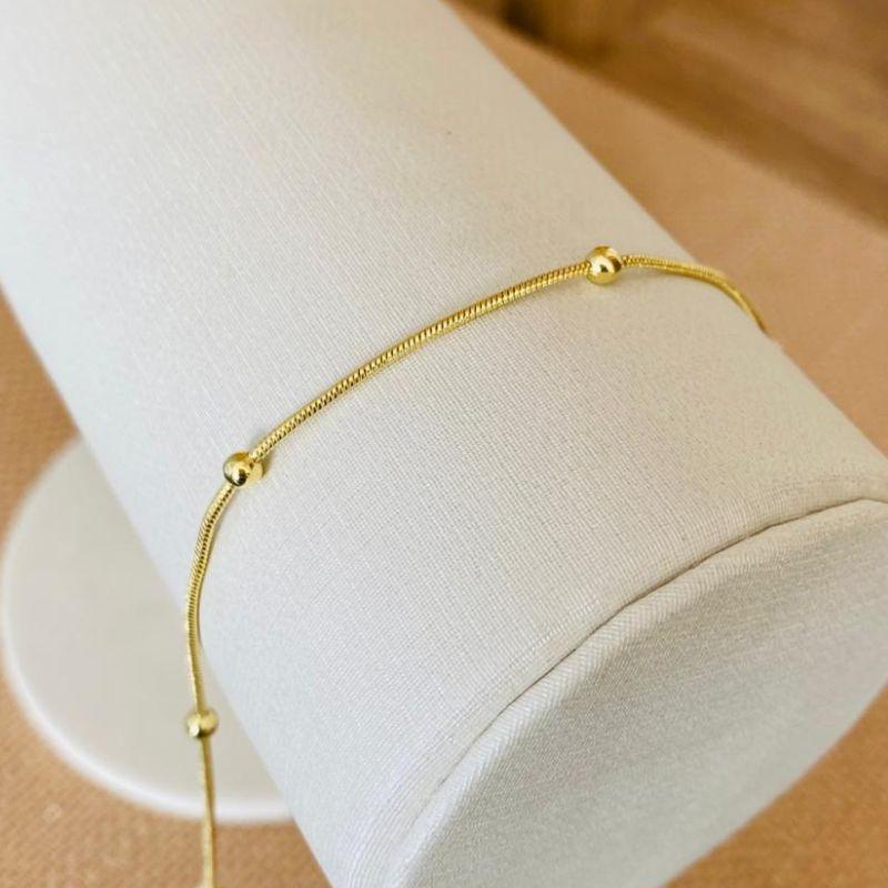 TORNOZELEIRA BOLINHAS