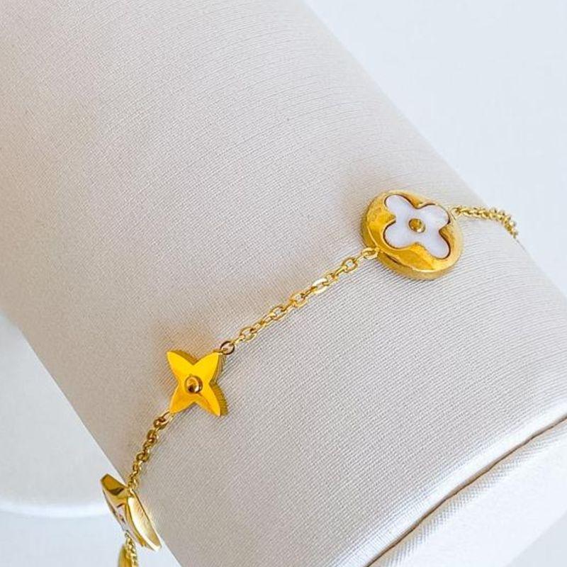PULSEIRA TREVO BRANCO E DOURADO STEEL